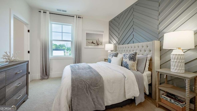 bedroom with carpet flooring and baseboards
