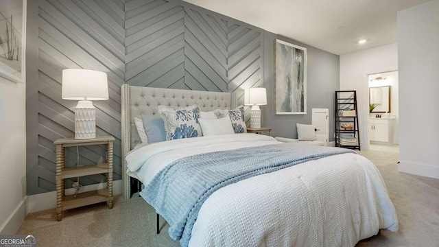 carpeted bedroom featuring baseboards, connected bathroom, and recessed lighting