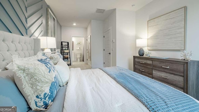 bedroom featuring carpet, ensuite bathroom, and recessed lighting