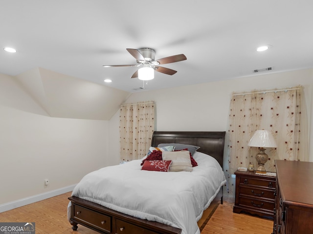 bedroom featuring baseboards, recessed lighting, vaulted ceiling, light wood-type flooring, and a ceiling fan