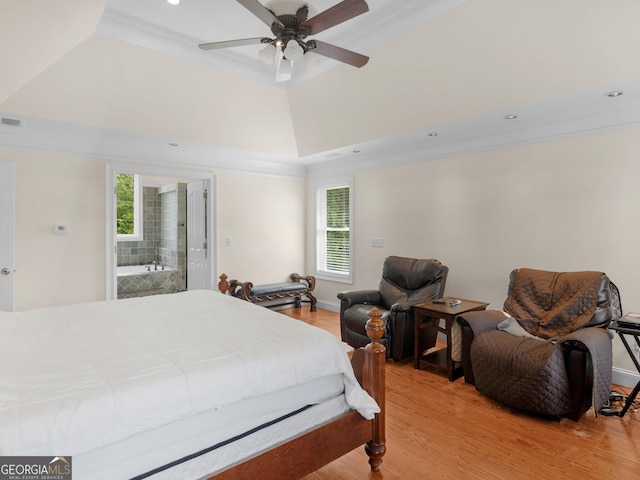 bedroom with ornamental molding, light wood finished floors, recessed lighting, a raised ceiling, and ceiling fan
