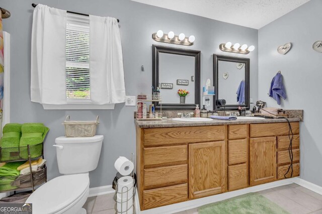 188 Mayapple Gln, Dawsonville, GA 30534 - full bath with toilet, tile patterned floors, double vanity, and baseboards