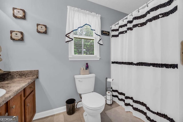 188 Mayapple Gln, Dawsonville, GA 30534 - bathroom featuring vanity, toilet, baseboards, tile patterned flooring, and a shower with curtain