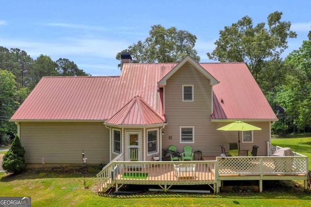 188 Mayapple Gln, Dawsonville, GA 30534 - rear view of house featuring a yard, metal roof, and a deck