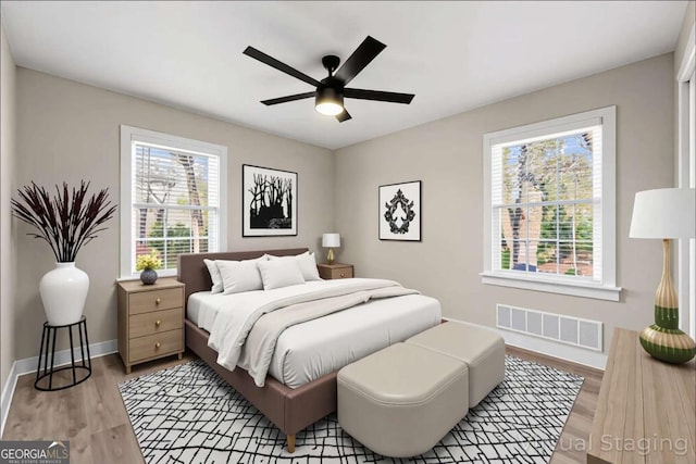 932 Mount Airy Dr SW, Atlanta, GA 30311 - bedroom with light wood-style flooring, baseboards, and ceiling fan