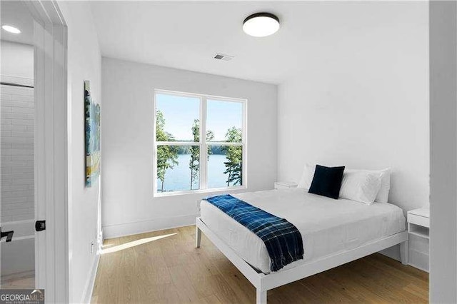132 Marina Parc Dr, Waleska, GA 30183 - bedroom with wood finished floors, baseboards, and a water view