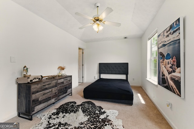 1689 Camden Forrest Way, Riverdale, GA 30296 - carpeted bedroom with lofted ceiling and ceiling fan
