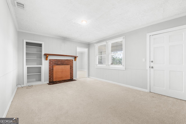 2445 Wilma Edwards Rd, Ellabell, GA 31308 - unfurnished living room featuring crown molding, a textured ceiling, carpet floors, a fireplace, and built in features