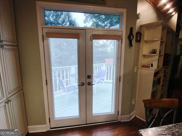 doorway to outside with french doors, dark wood-style flooring, and baseboards