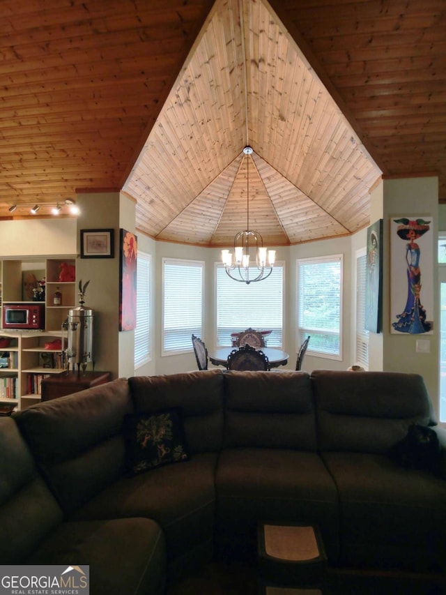 living room with wooden ceiling, a chandelier, and lofted ceiling