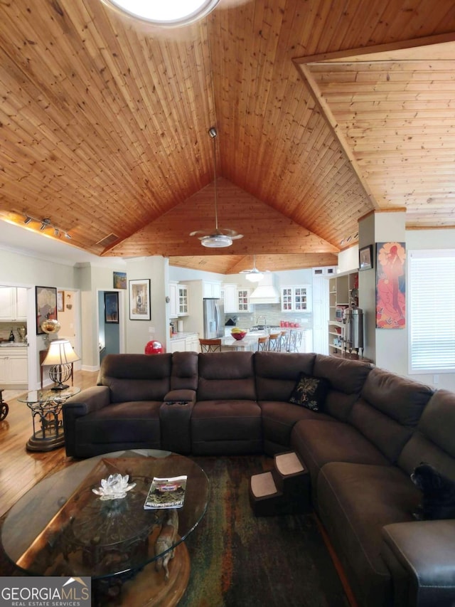 living room with vaulted ceiling, wood ceiling, and wood finished floors