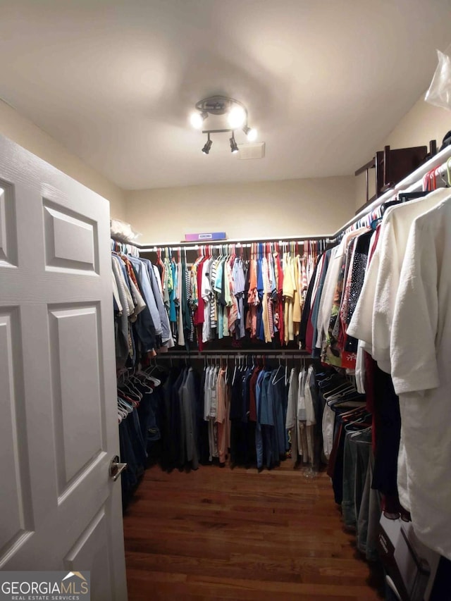 spacious closet with wood finished floors