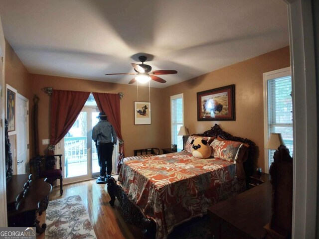 bedroom featuring wood finished floors and ceiling fan