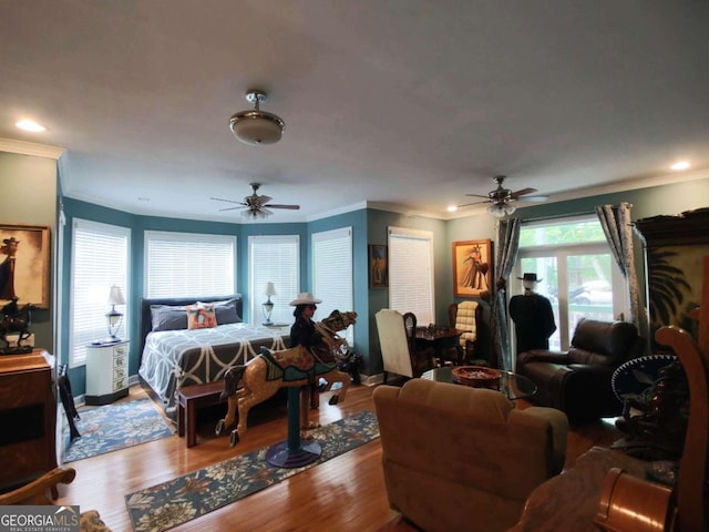 bedroom featuring crown molding, wood finished floors, recessed lighting, baseboards, and a ceiling fan