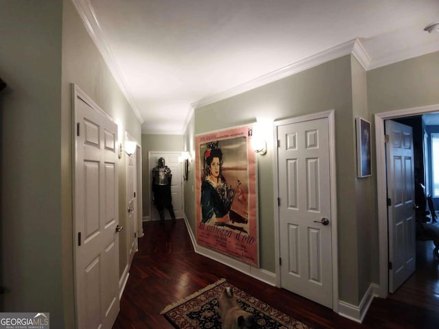 hall featuring crown molding, wood finished floors, and baseboards