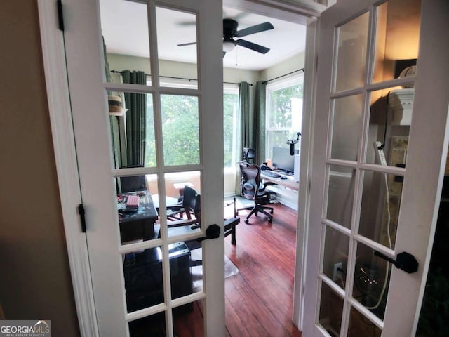 home office featuring ceiling fan, wood finished floors, and french doors