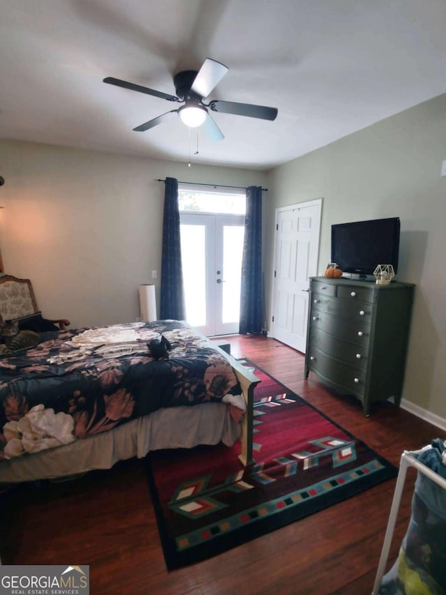 bedroom featuring french doors, wood finished floors, a ceiling fan, and baseboards