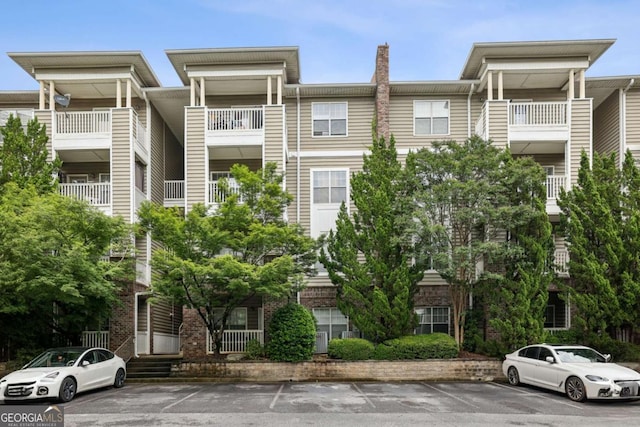 2700 Pine Tree Rd NE Unit 1208, Atlanta, GA 30324 - view of property featuring uncovered parking