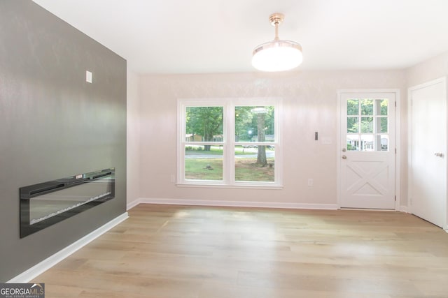 330 Stonehenge Way, Athens, GA 30606 - unfurnished dining area with light wood-type flooring and baseboards