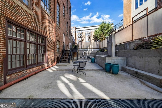 650 Glen Iris Dr NE Unit 27, Atlanta, GA 30308 - view of patio featuring stairway