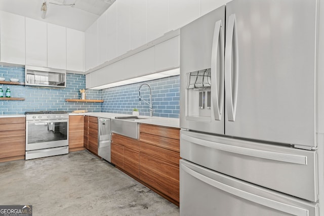 434 Marietta St NW Unit 401, Atlanta, GA 30313 - kitchen with appliances with stainless steel finishes, modern cabinets, light countertops, finished concrete flooring, and white cabinetry