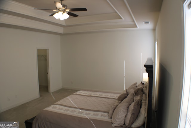 878 W Union Grove Cir, Auburn, GA 30011 - carpeted bedroom with a raised ceiling, a spacious closet, and a ceiling fan