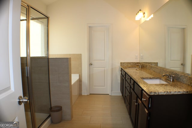 878 W Union Grove Cir, Auburn, GA 30011 - bathroom featuring double vanity, a garden tub, and an enclosed shower