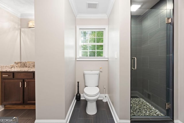 full bath with a shower stall, baseboards, toilet, vanity, and ornamental molding