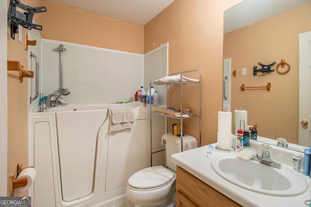4732 Browns Mill Ferry Rd, Lithonia, GA 30038 - bathroom featuring vanity, toilet, and a textured ceiling