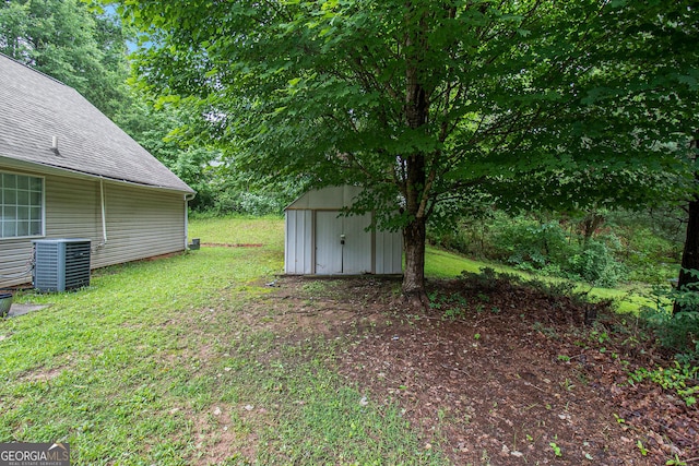 4732 Browns Mill Ferry Rd, Lithonia, GA 30038 - view of green lawn featuring central AC unit
