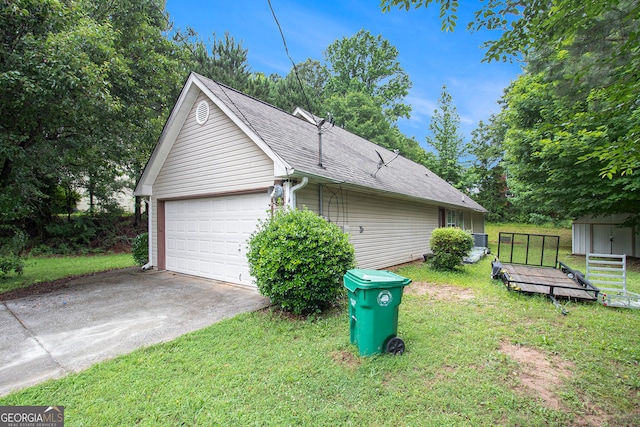 4732 Browns Mill Ferry Rd, Lithonia, GA 30038 - view of side of home featuring driveway, a lawn, roof with shingles, and an attached garage