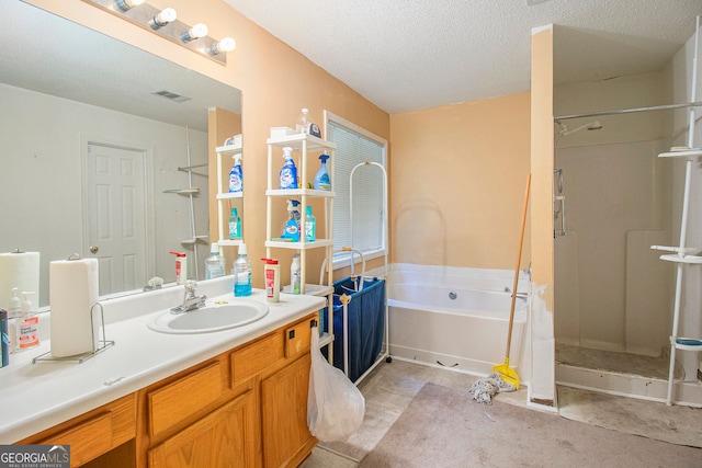 4732 Browns Mill Ferry Rd, Lithonia, GA 30038 - full bathroom featuring a stall shower, a garden tub, vanity, and a textured ceiling