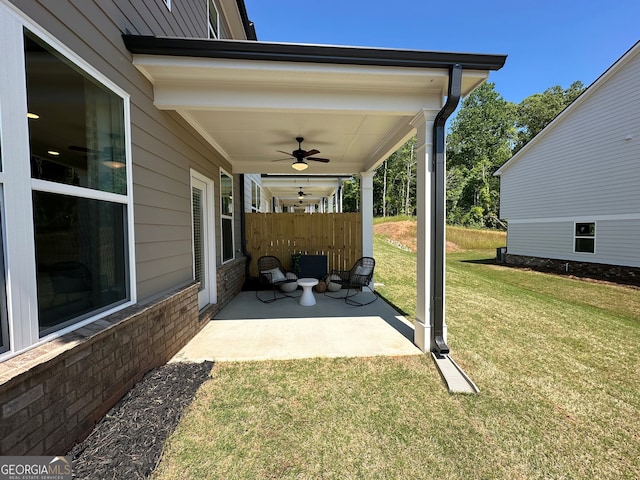 view of patio featuring ceiling fan