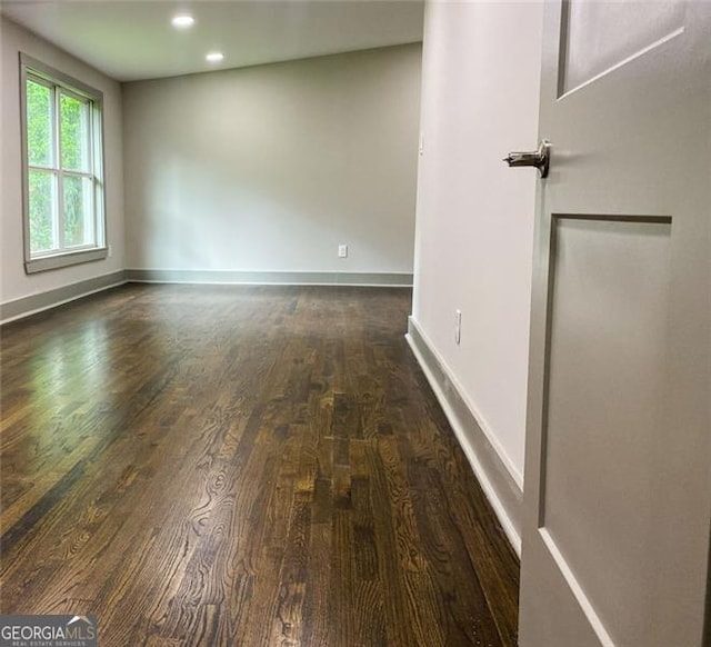 664 Florence Pl NW, Atlanta, GA 30318 - spare room with dark wood finished floors, recessed lighting, and baseboards