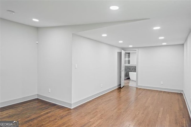 664 Florence Pl NW, Atlanta, GA 30318 - below grade area with recessed lighting, wood finished floors, and baseboards