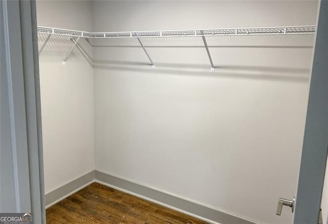 664 Florence Pl NW, Atlanta, GA 30318 - walk in closet with dark wood-type flooring