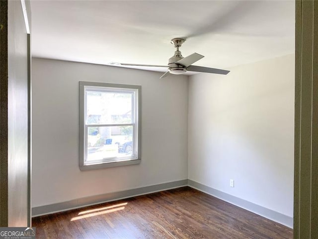 664 Florence Pl NW, Atlanta, GA 30318 - spare room with a ceiling fan, dark wood-style flooring, and baseboards
