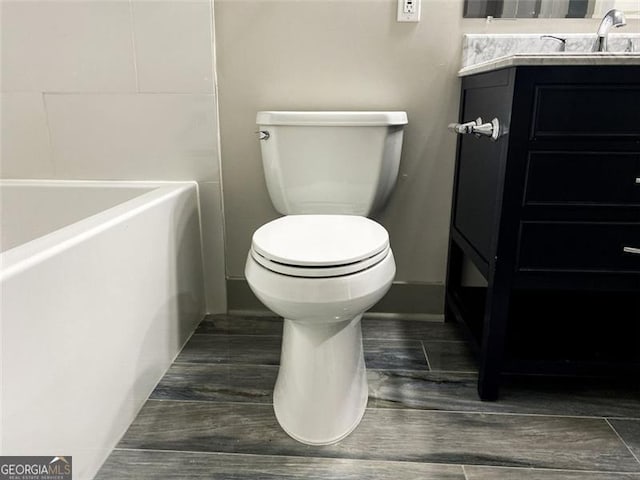 664 Florence Pl NW, Atlanta, GA 30318 - full bathroom featuring toilet, vanity, and a tub
