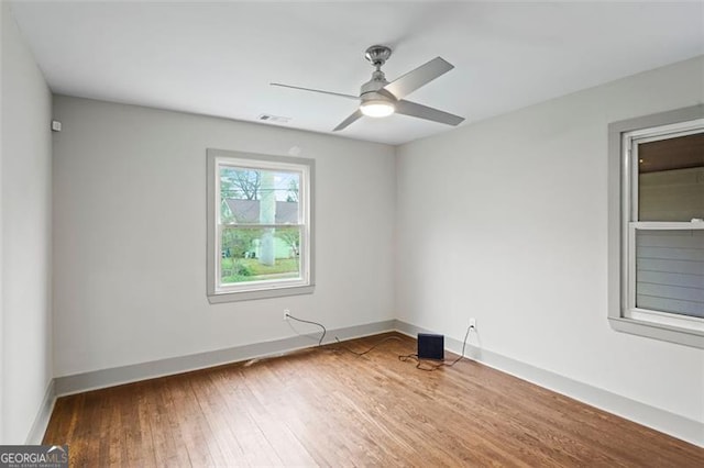 664 Florence Pl NW, Atlanta, GA 30318 - spare room with a ceiling fan, wood finished floors, and baseboards
