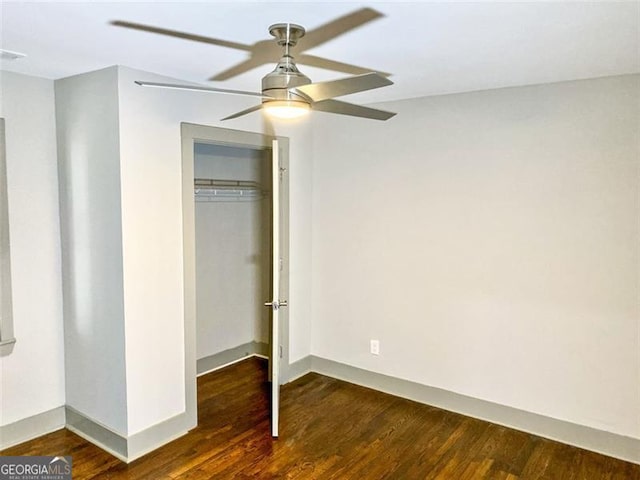 664 Florence Pl NW, Atlanta, GA 30318 - unfurnished bedroom featuring wood finished floors, a closet, and baseboards