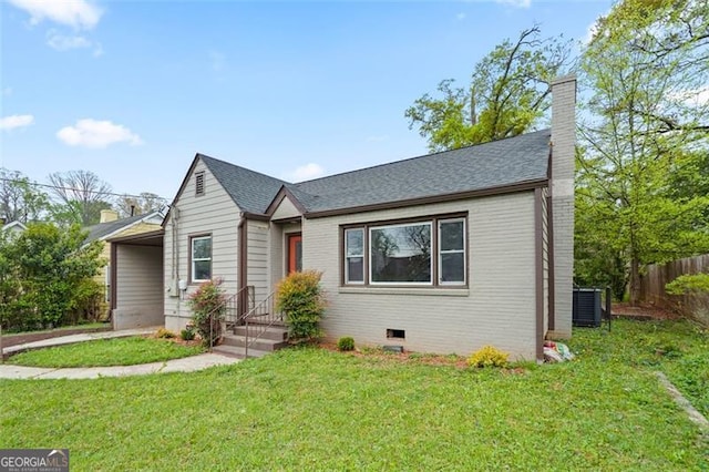 664 Florence Pl NW, Atlanta, GA 30318 - bungalow-style house with central AC unit, an attached carport, a chimney, and roof with shingles