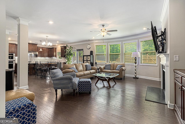 4815 Edgemoore Trce, Cumming, GA 30040 - living area with a ceiling fan, a chandelier, recessed lighting, dark wood-style floors, and crown molding