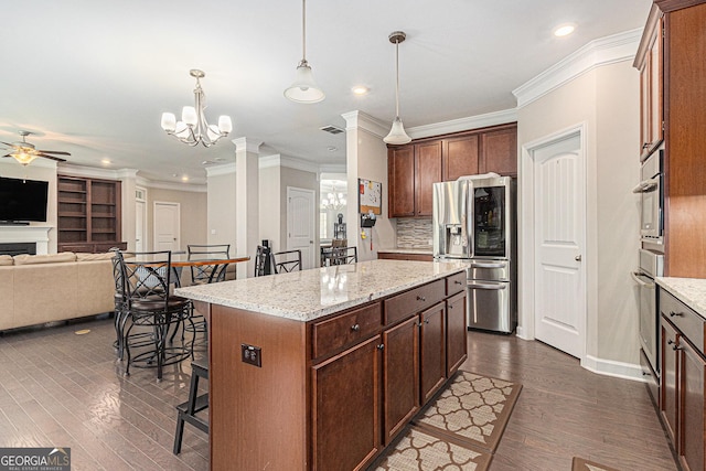 4815 Edgemoore Trce, Cumming, GA 30040 - kitchen featuring stainless steel fridge, a ceiling fan, open floor plan, a chandelier, and crown molding