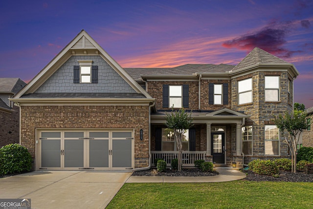 4815 Edgemoore Trce, Cumming, GA 30040 - view of front facade with a porch, concrete driveway, a yard, and brick siding