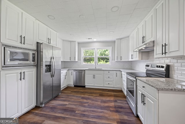 1766 Washington Hwy, Elberton, GA 30635 - kitchen with stainless steel appliances, under cabinet range hood, white cabinetry, and recessed lighting
