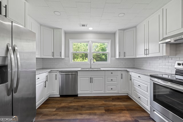 1766 Washington Hwy, Elberton, GA 30635 - kitchen with appliances with stainless steel finishes, a sink, white cabinets, backsplash, and light stone counters