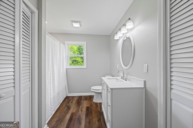 1766 Washington Hwy, Elberton, GA 30635 - bathroom with a closet, vanity, wood finished floors, and baseboards