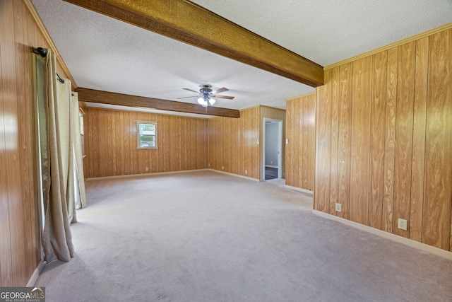 1766 Washington Hwy, Elberton, GA 30635 - unfurnished room with a textured ceiling, beam ceiling, wood walls, ceiling fan, and light carpet