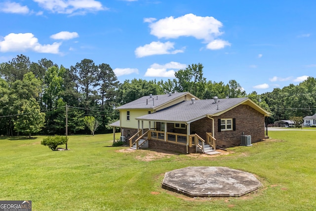 1766 Washington Hwy, Elberton, GA 30635 - back of property featuring brick siding, central air condition unit, a lawn, covered porch, and a shingled roof