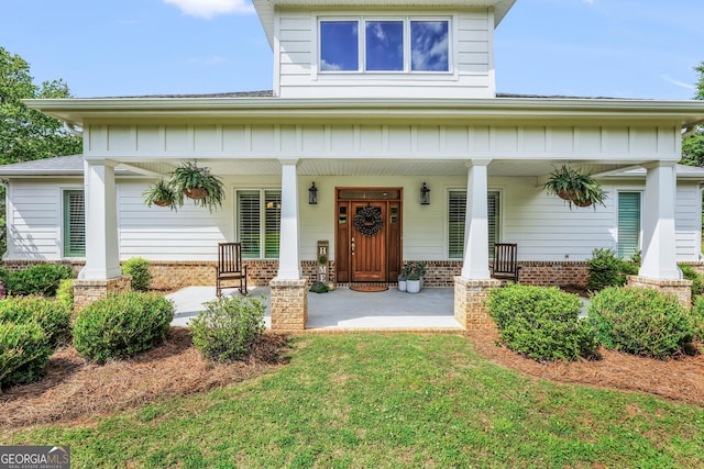 377 Parker Rd, Mcdonough, GA 30252 - view of front of property featuring covered porch and brick siding
